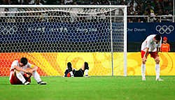 De Jonge Duivels liggen verslagen op het veld. De gouden droom liep uit op een rasechte nachtmerrie.belga<br>