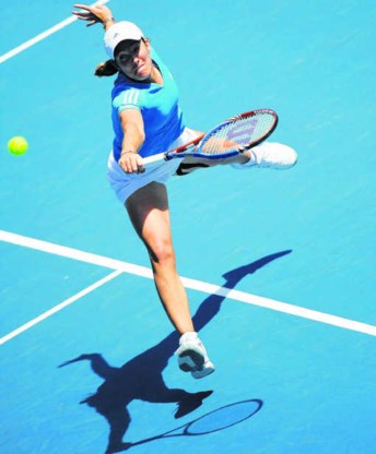 Justine Henin: 'Het was even wennen. Het was immers de eerste keer dat ik hier een partij in volle zon speelde.'pn