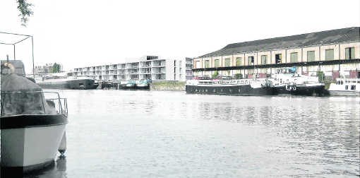 Het appartementencomplex van het Stadsontwikkelingsbedrijf ligt pal aan het water en heeft bovenaan een gemeenschappelijke ruimte met een prachtig uitzicht.if
