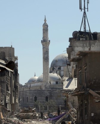 Een verwoest moskee in Homs. Er is strijd op leven en dood aan de gang rond de islam.