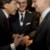 Premier Di Rupo praat met oning Filip, minister-president Kris Peeters kijkt lachend toe.
