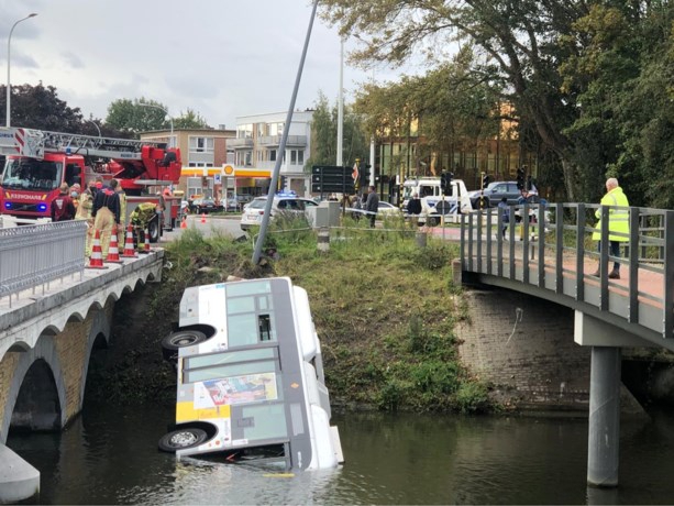 Regular bus runs in water in Bruges