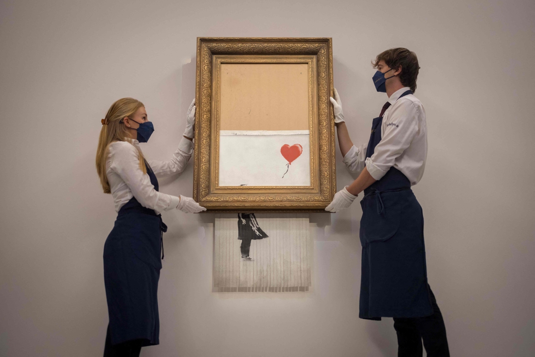 Part-shredded Banksy painting auctioned for 22 million…