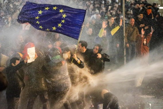 Symbolic images during the mass protest in Tbilisi: water cannons do not deter demonstrators carrying the European flag