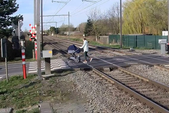 Woman with pram crosses closed level crossing, moped rider hit at another closed level crossing